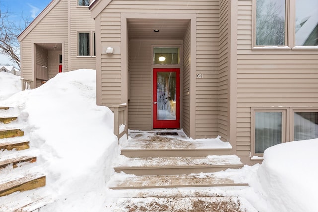 view of snow covered property entrance