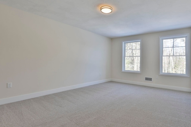 empty room featuring carpet flooring