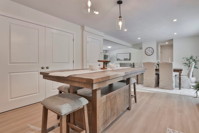 kitchen featuring light hardwood / wood-style floors and hanging light fixtures