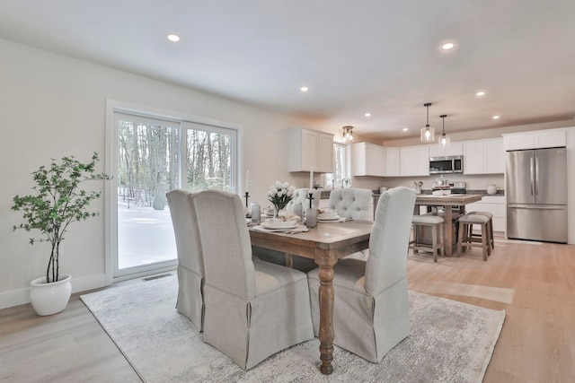 dining room featuring light hardwood / wood-style flooring