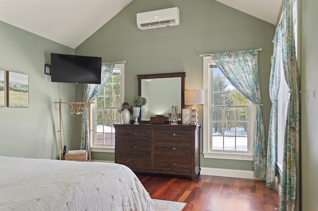 bedroom with dark hardwood / wood-style flooring, vaulted ceiling, and a wall unit AC