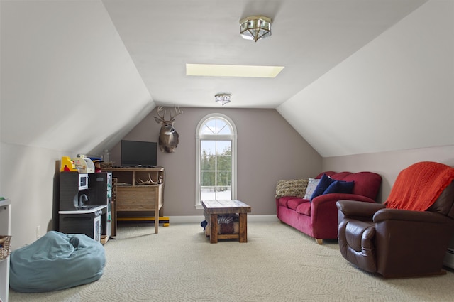 game room with carpet flooring and vaulted ceiling with skylight