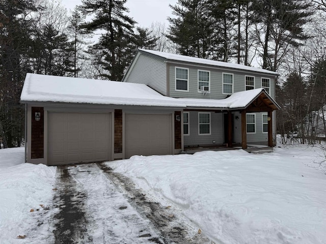 view of front of house with cooling unit and a garage