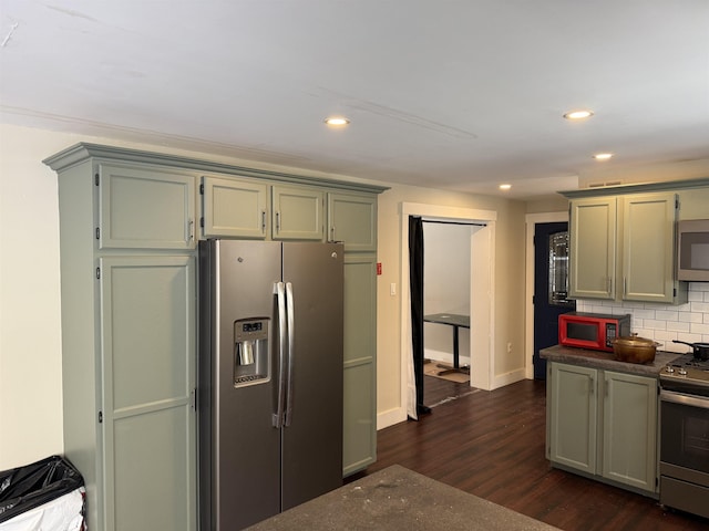 kitchen with backsplash, dark wood finished floors, recessed lighting, stainless steel appliances, and baseboards