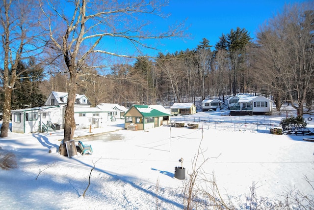 view of yard covered in snow