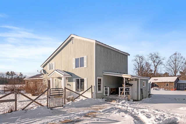 view of snow covered house