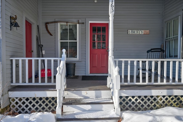 view of snow covered property entrance