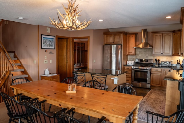 dining room with a chandelier and a textured ceiling