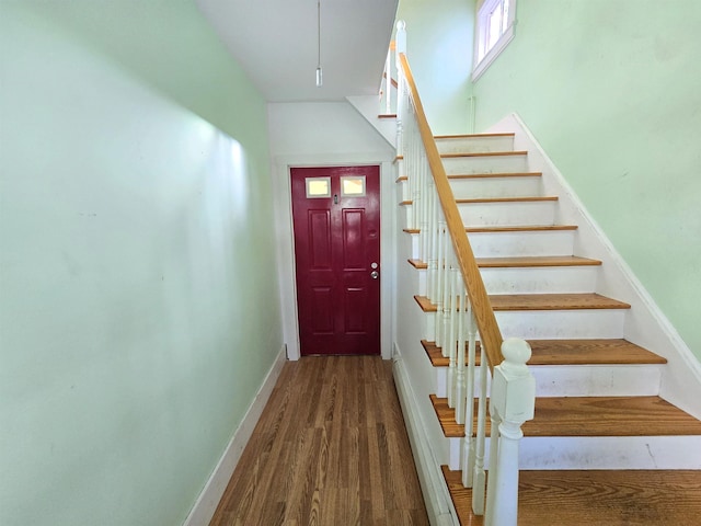 stairway featuring hardwood / wood-style flooring