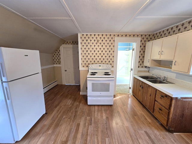 kitchen featuring sink, white appliances, a baseboard radiator, and light wood-type flooring