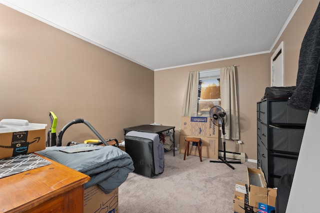 bedroom with ornamental molding, a baseboard heating unit, light colored carpet, and a textured ceiling