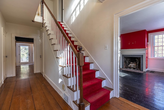 stairway featuring hardwood / wood-style flooring