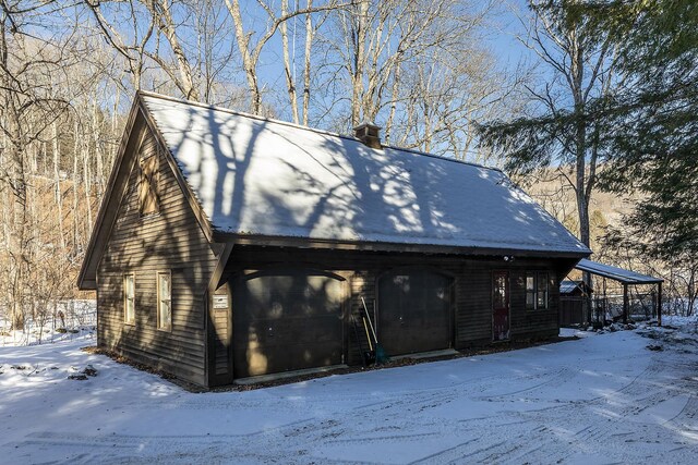 view of snow covered garage