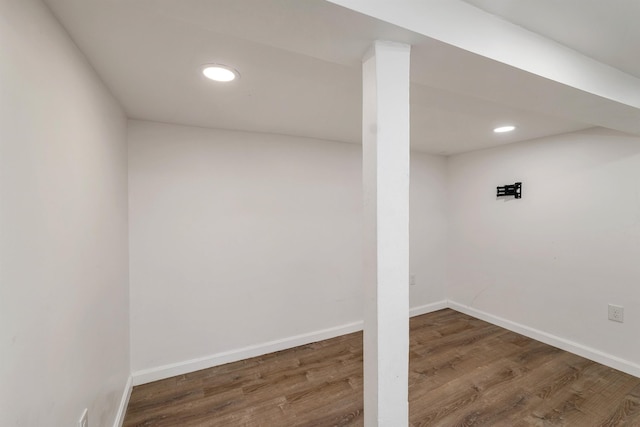 basement featuring dark hardwood / wood-style floors