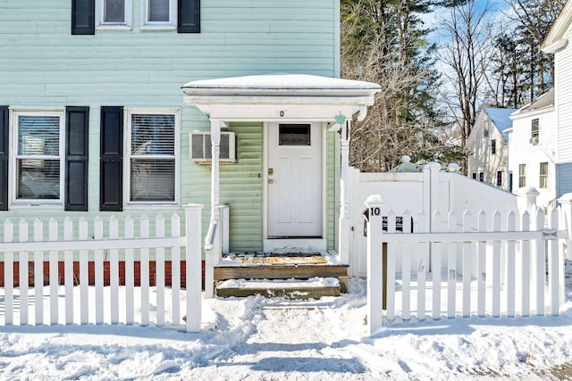 view of snow covered property entrance