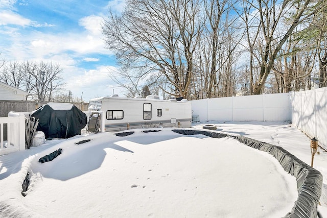 view of yard layered in snow