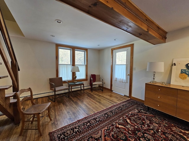 living area featuring a baseboard radiator and dark hardwood / wood-style floors