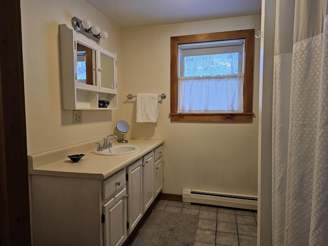 bathroom with vanity, a baseboard radiator, and tile patterned floors