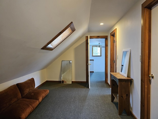 additional living space featuring vaulted ceiling and dark colored carpet