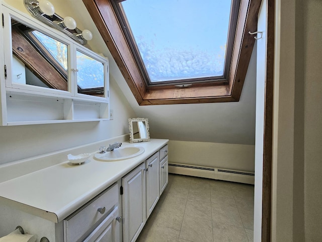 bathroom featuring vanity, tile patterned flooring, a baseboard radiator, and vaulted ceiling