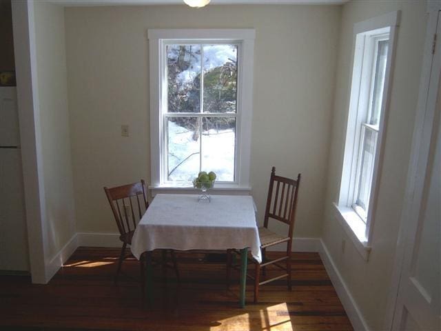 dining area featuring dark hardwood / wood-style flooring