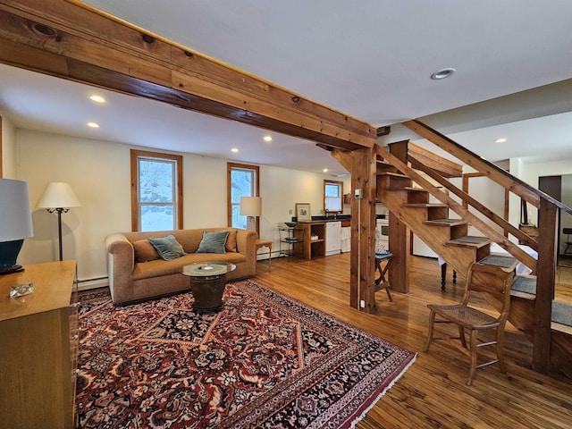 living room featuring a baseboard radiator and hardwood / wood-style floors