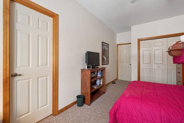 bedroom featuring a closet and light carpet