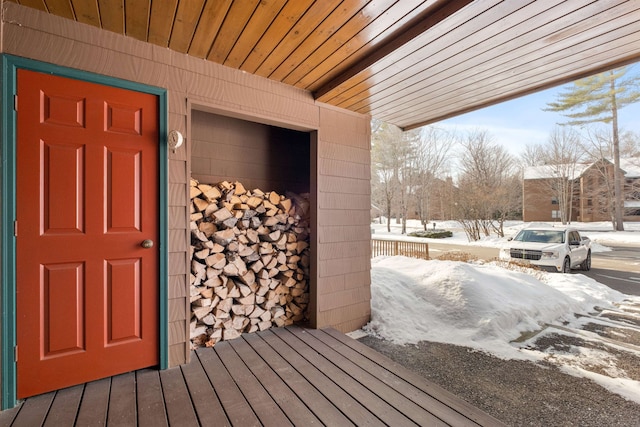 view of snow covered property entrance