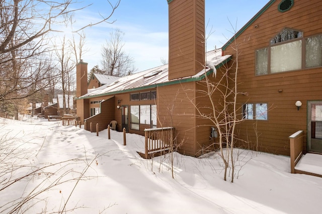 view of snow covered house