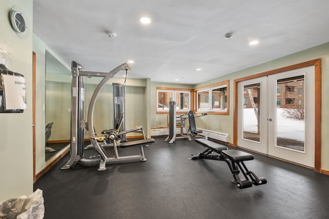 exercise room with french doors and a baseboard radiator