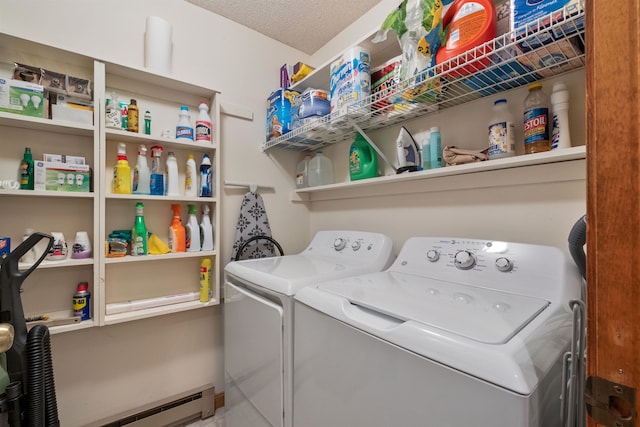 laundry area featuring a baseboard radiator, independent washer and dryer, and a textured ceiling