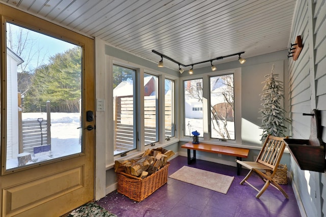 sunroom / solarium with track lighting