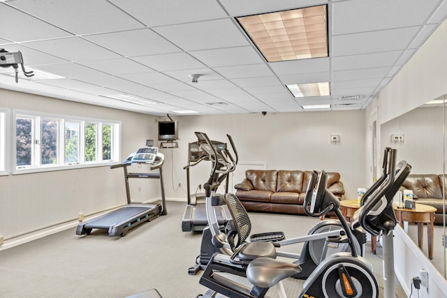 workout area with a drop ceiling and carpet floors