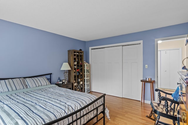 bedroom featuring a closet and light hardwood / wood-style flooring