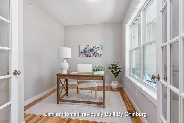 office space featuring hardwood / wood-style flooring and a healthy amount of sunlight