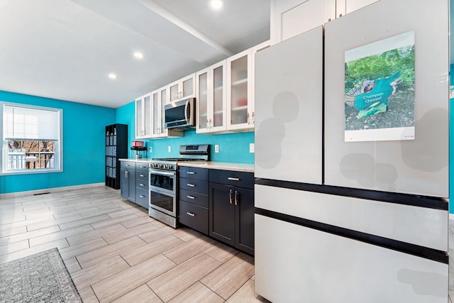 kitchen with white cabinetry and stainless steel appliances