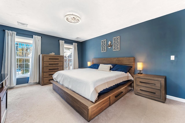 bedroom with light colored carpet