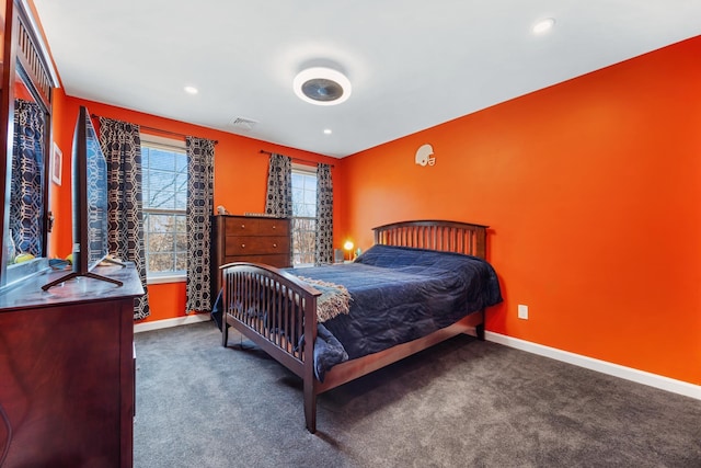 bedroom featuring dark colored carpet