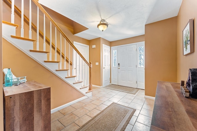 foyer featuring light tile patterned floors