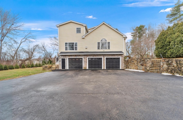 view of side of home with a garage