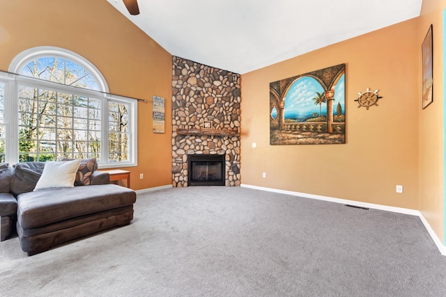 living room with carpet, high vaulted ceiling, and a fireplace