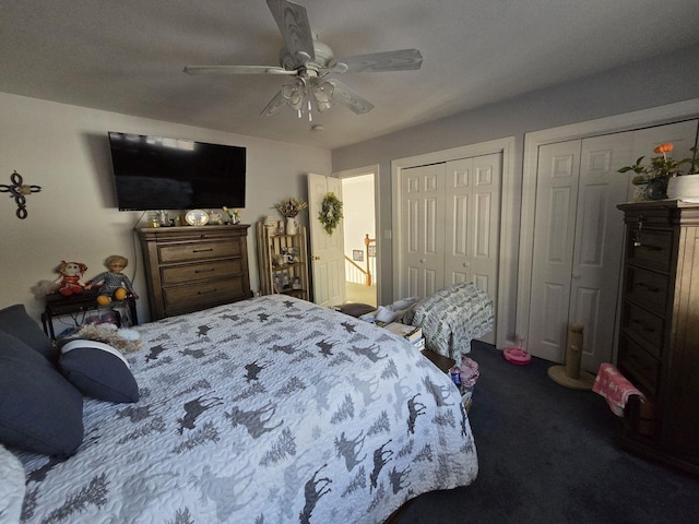 bedroom featuring carpet floors, two closets, and ceiling fan