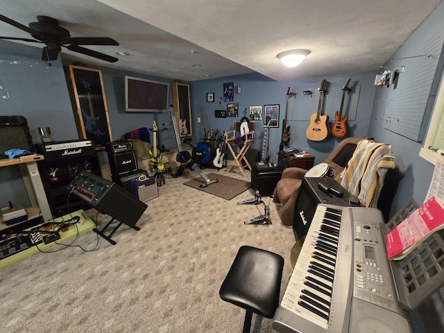 exercise area with carpet floors and ceiling fan