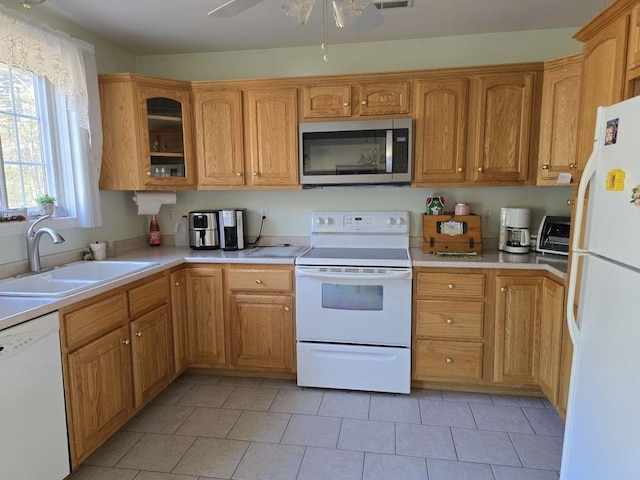 kitchen featuring sink, white appliances, light tile patterned floors, and ceiling fan