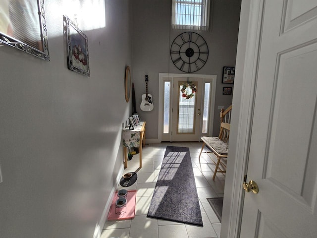 entryway with light tile patterned floors