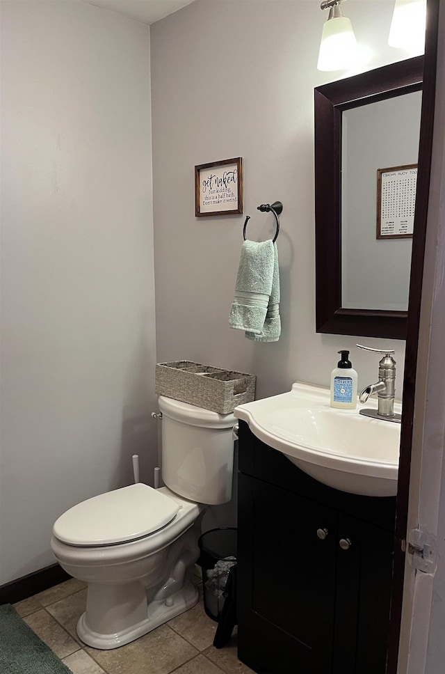 bathroom with tile patterned floors, toilet, and vanity