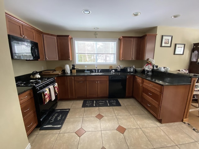 kitchen with sink, black appliances, light tile patterned flooring, kitchen peninsula, and dark stone counters