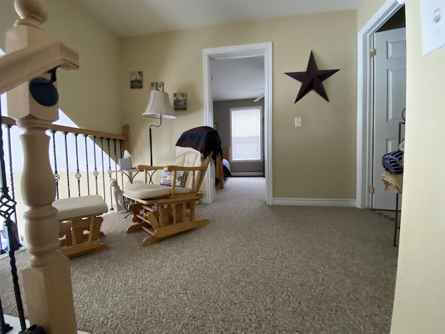 sitting room with carpet flooring