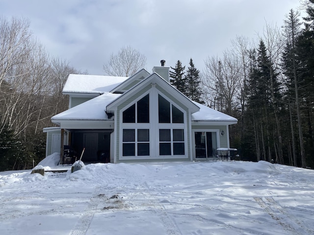 view of snow covered house