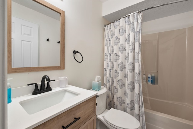 full bathroom with vanity, shower / bath combination with curtain, and toilet